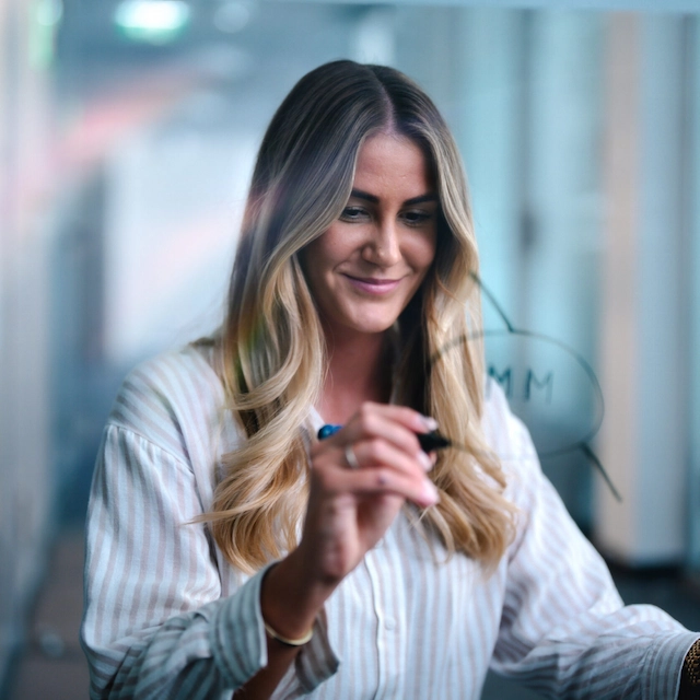 woman drawing in a blackboard